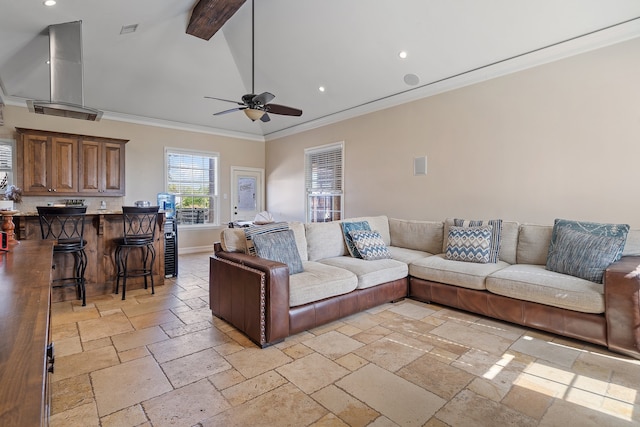 living room with ceiling fan and crown molding