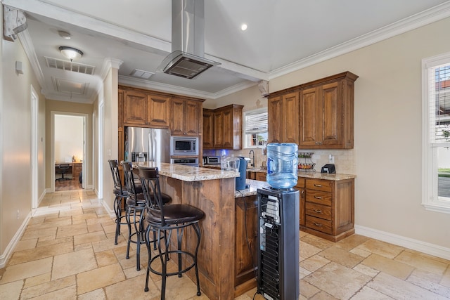 kitchen featuring a kitchen island, backsplash, appliances with stainless steel finishes, light stone countertops, and crown molding