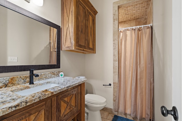 bathroom featuring vanity, toilet, and a shower with shower curtain