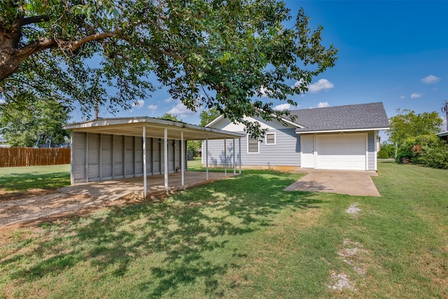 view of front of property with a carport, a garage, and a front lawn