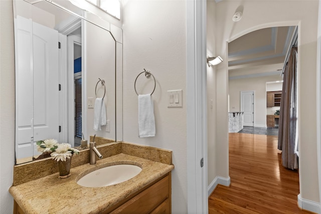 bathroom with vanity and wood-type flooring