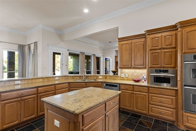 kitchen with sink, stainless steel double oven, tasteful backsplash, kitchen peninsula, and crown molding