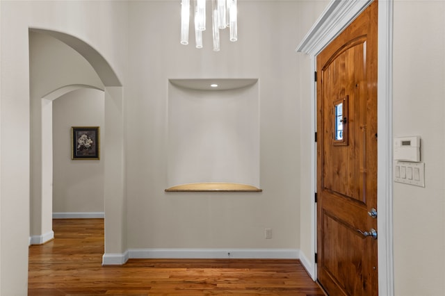 foyer entrance with hardwood / wood-style flooring