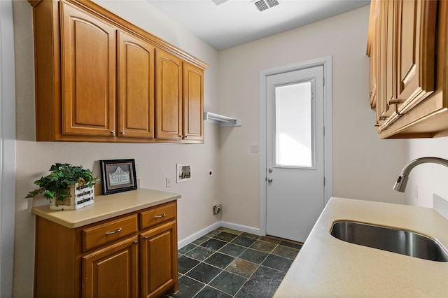 laundry room featuring cabinets, hookup for a washing machine, electric dryer hookup, and sink