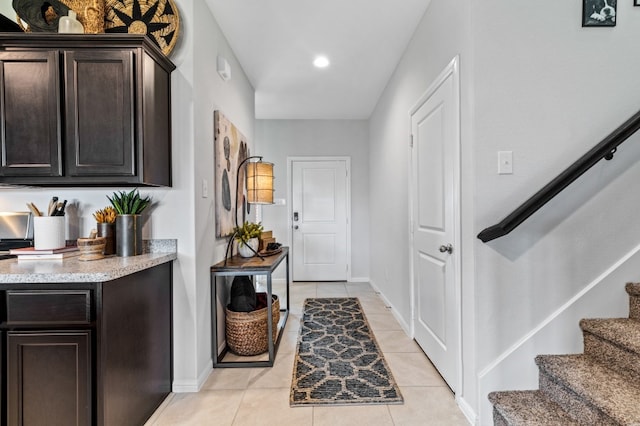 foyer featuring light tile patterned floors