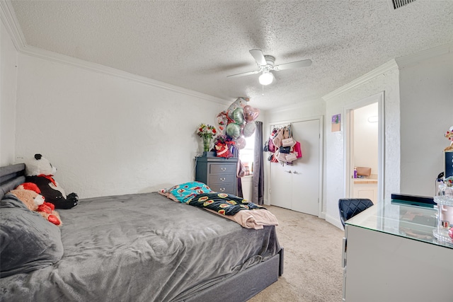 bedroom with a textured ceiling, light colored carpet, crown molding, and ceiling fan