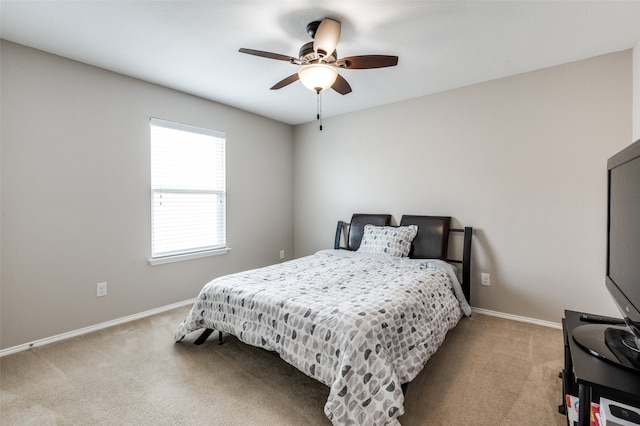 bedroom featuring light carpet and ceiling fan