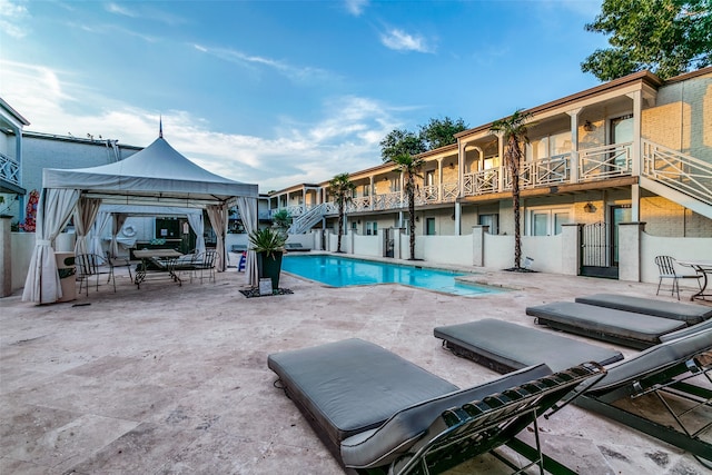 view of pool featuring a patio area and a gazebo