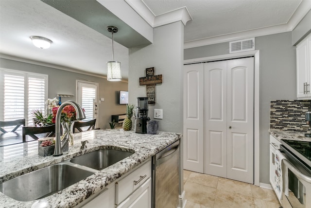 kitchen with sink, white cabinetry, dishwasher, and light tile patterned floors