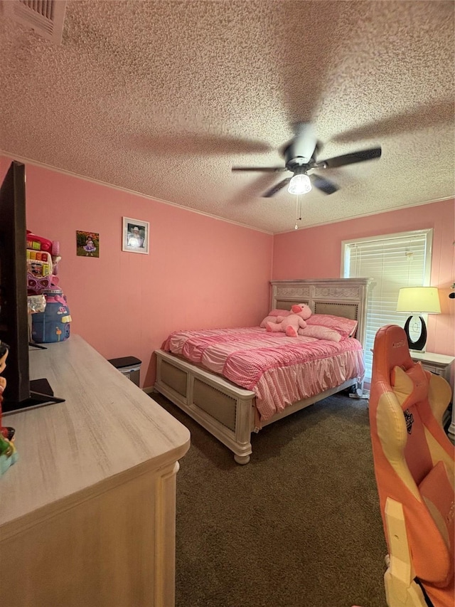 carpeted bedroom featuring ceiling fan and a textured ceiling