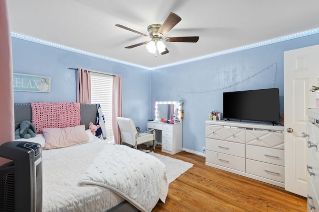 bedroom with light wood-type flooring and ceiling fan