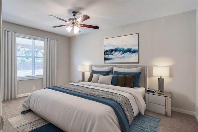 bedroom with carpet floors, a ceiling fan, and baseboards