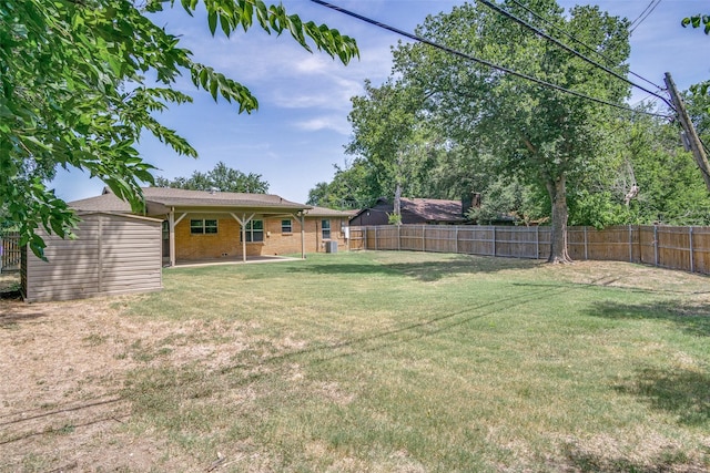 view of yard with a patio and a fenced backyard