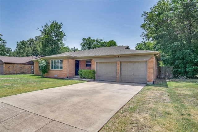 ranch-style house featuring brick siding, an attached garage, fence, driveway, and a front lawn