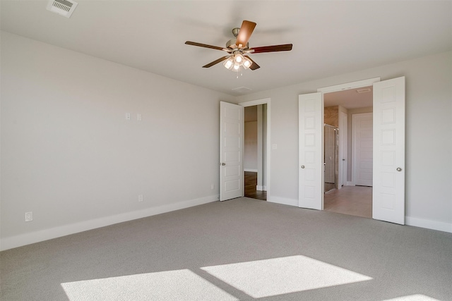 unfurnished bedroom featuring carpet floors and ceiling fan