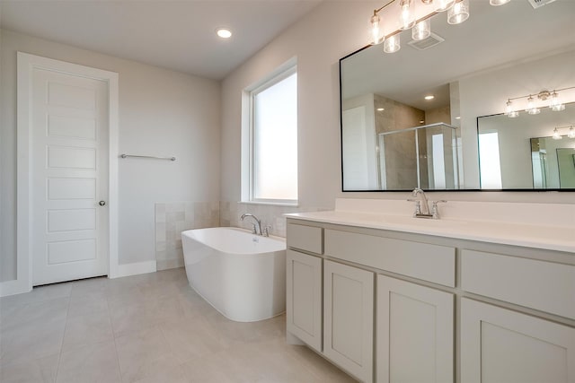 bathroom with vanity, plus walk in shower, and tile patterned floors