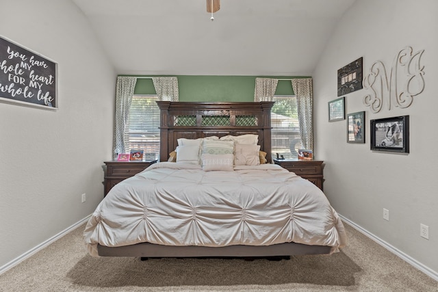 carpeted bedroom featuring vaulted ceiling