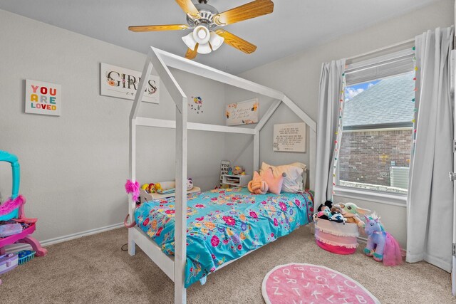 carpeted bedroom featuring ceiling fan and multiple windows