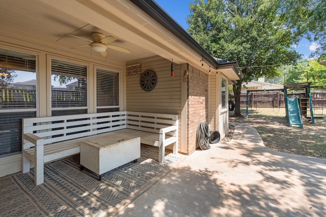 view of patio / terrace with ceiling fan and a playground