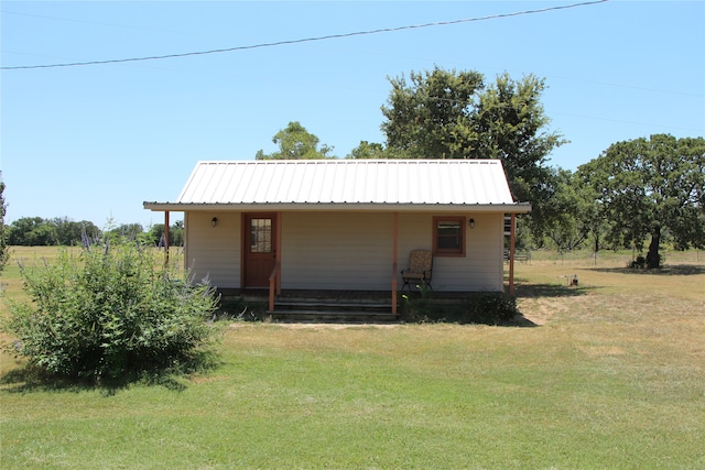 view of outbuilding with a yard