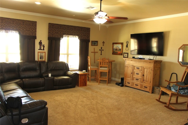 carpeted living room with ceiling fan and crown molding