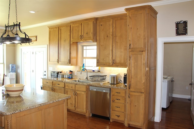 kitchen featuring dark wood-type flooring, tasteful backsplash, dishwasher, washer and clothes dryer, and sink