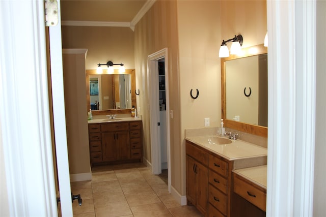 bathroom featuring crown molding, double sink vanity, and tile patterned floors