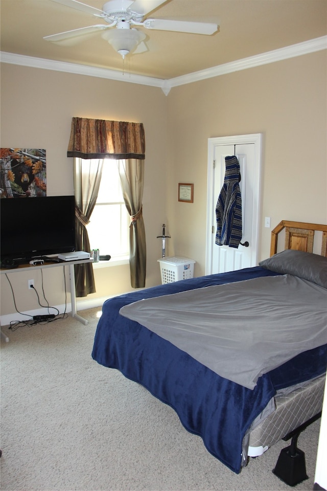 bedroom with carpet floors, crown molding, and ceiling fan