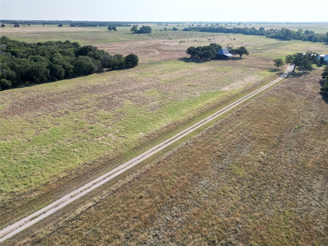 birds eye view of property with a rural view