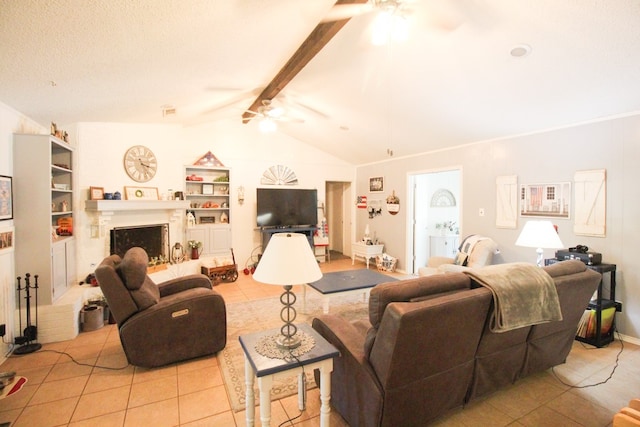 tiled living room featuring vaulted ceiling with beams, built in shelves, and ceiling fan