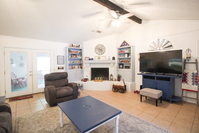 tiled living room with vaulted ceiling with beams, french doors, built in shelves, a textured ceiling, and ceiling fan