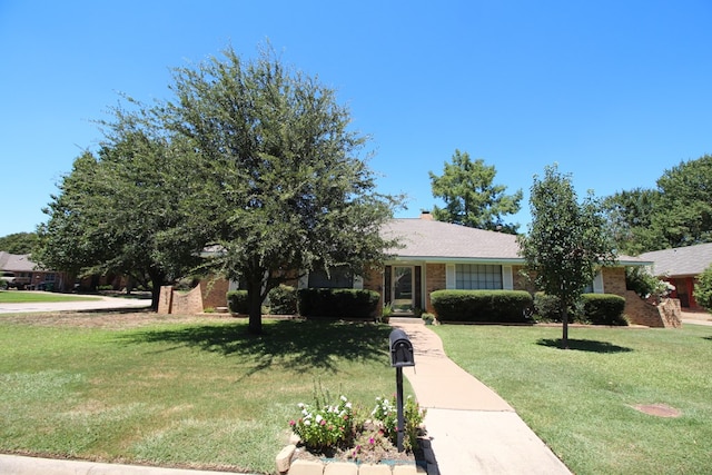 view of front of home with a front lawn