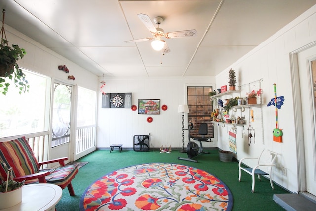 playroom with carpet floors and ceiling fan