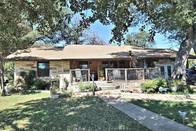 rear view of property with a yard