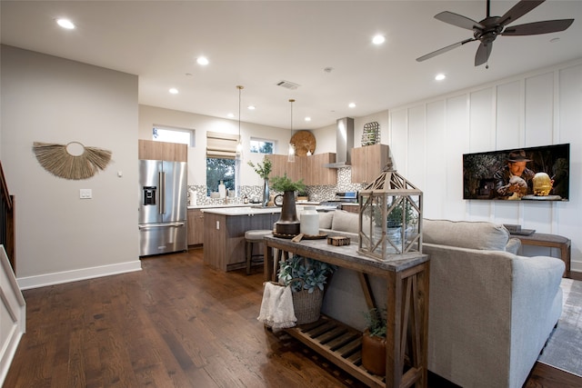 living room with dark hardwood / wood-style floors and ceiling fan