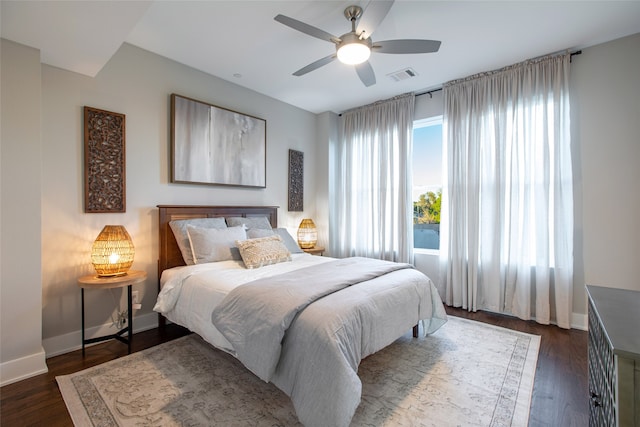 bedroom featuring dark hardwood / wood-style floors and ceiling fan