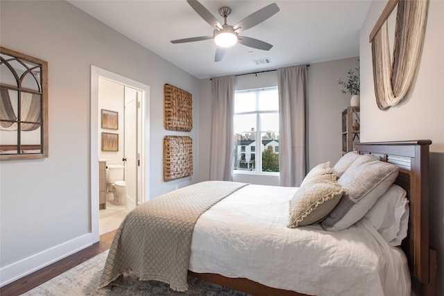 bedroom featuring ensuite bath, ceiling fan, and hardwood / wood-style floors