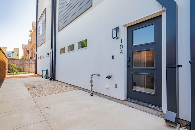 property entrance with a patio area