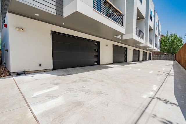 exterior space with a balcony and a garage