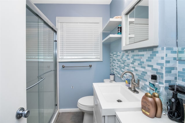 bathroom with an enclosed shower, decorative backsplash, vanity, and toilet