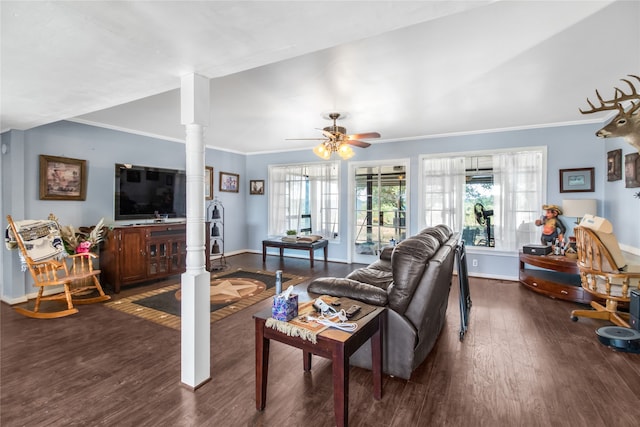 living room featuring ceiling fan, decorative columns, crown molding, and hardwood / wood-style flooring