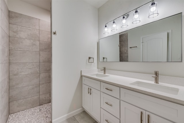 bathroom with tile patterned floors and double vanity