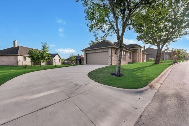 view of front of house with a garage and a front lawn