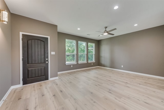 foyer entrance featuring light hardwood / wood-style floors and ceiling fan