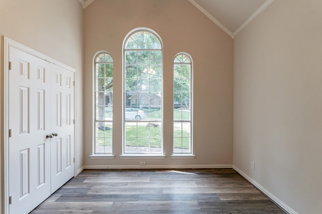 empty room featuring crown molding and hardwood / wood-style floors