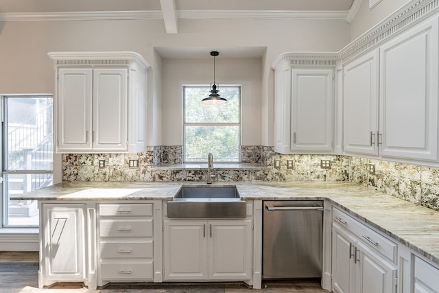 kitchen with white cabinets, decorative backsplash, crown molding, light stone countertops, and appliances with stainless steel finishes