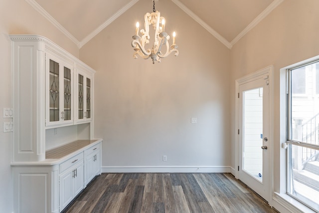 kitchen featuring dishwasher, white cabinets, and backsplash