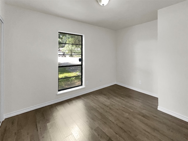 empty room featuring dark hardwood / wood-style floors