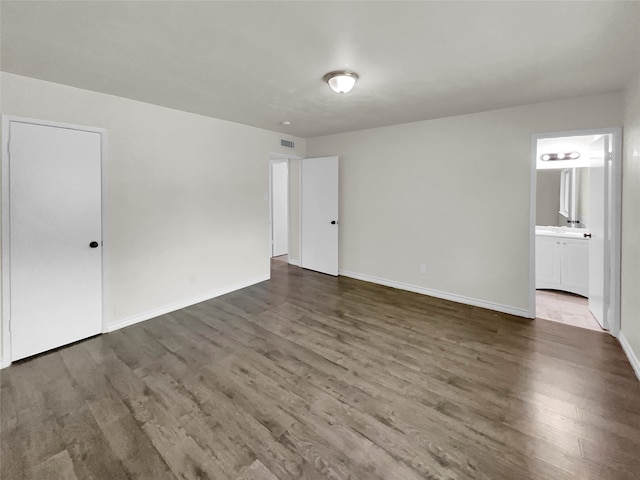 empty room featuring hardwood / wood-style flooring