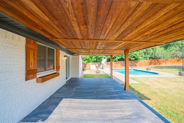 view of patio featuring a fenced in pool